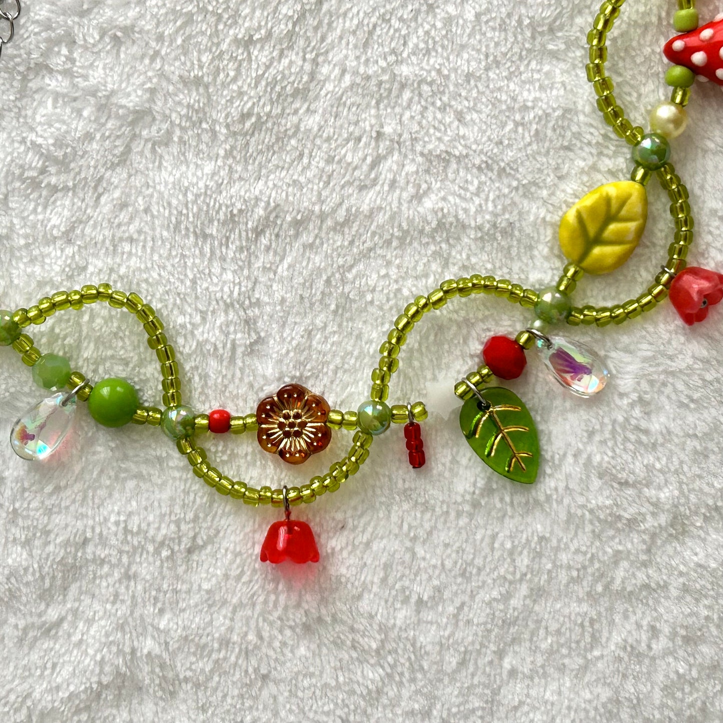 Necklace with a mushroom and vines