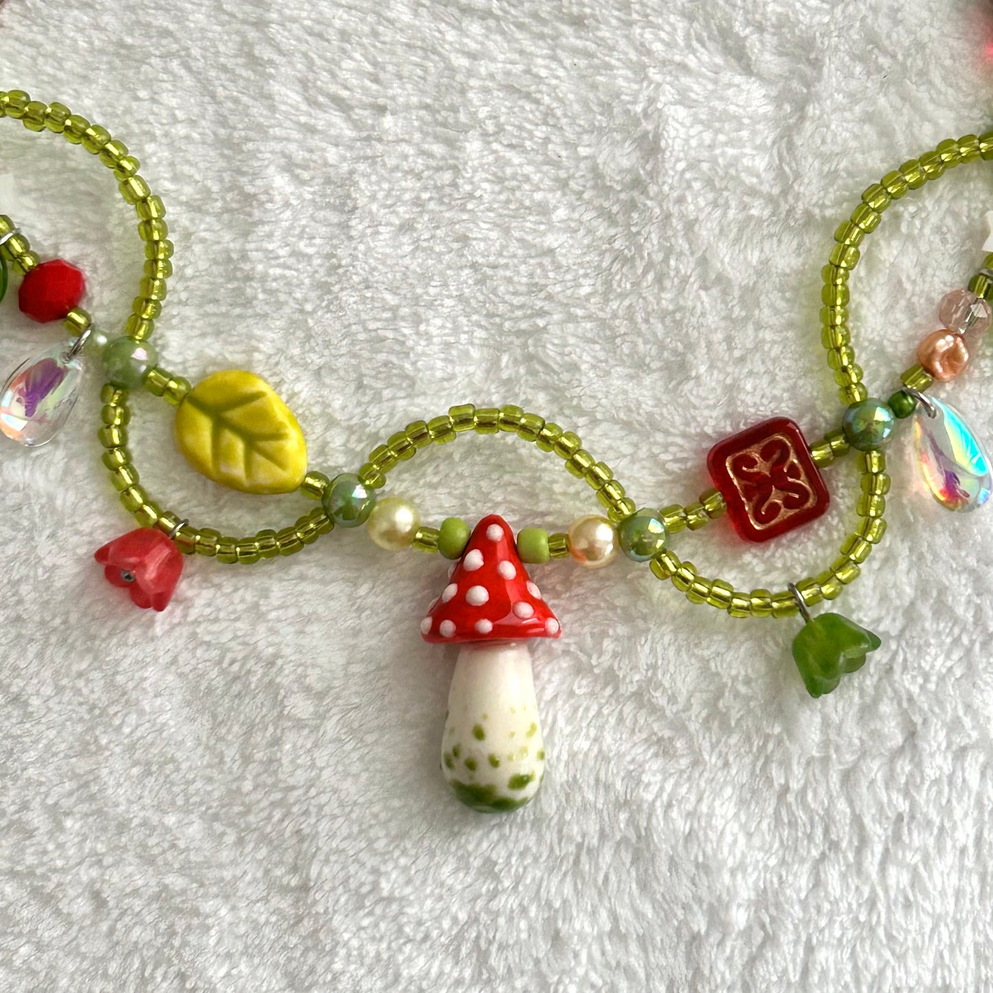 Necklace with a mushroom and vines