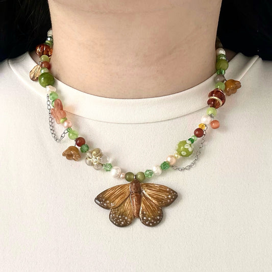 Necklace with brown butterfly