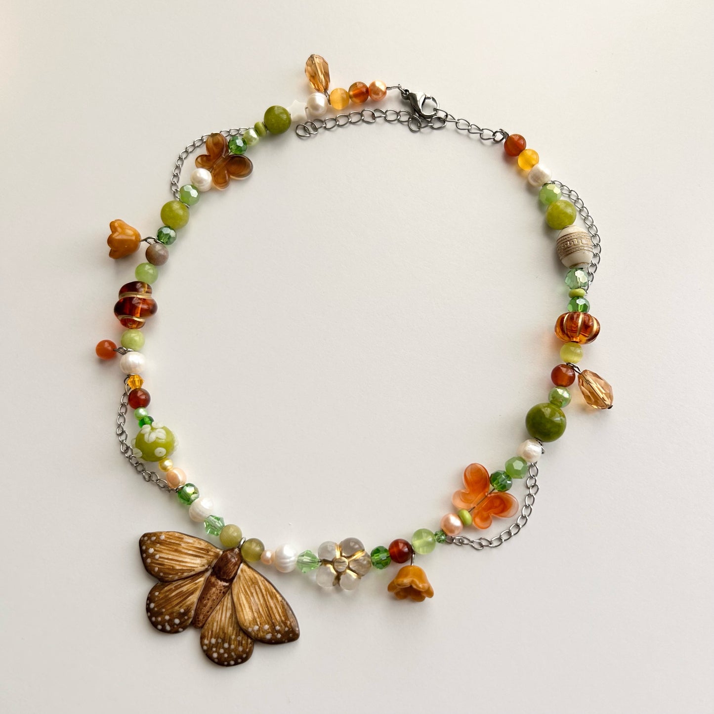 Necklace with brown butterfly